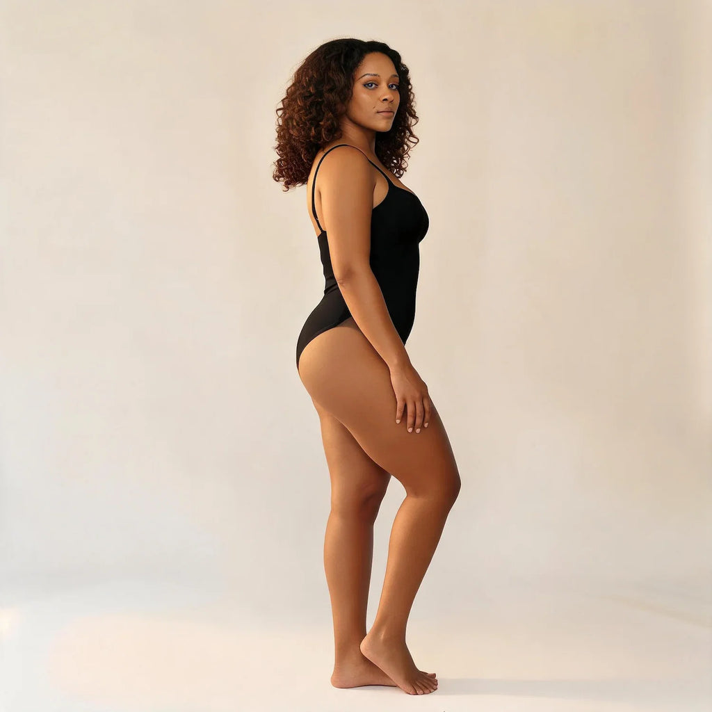 Body gainant ventre plat noir, vue de profil