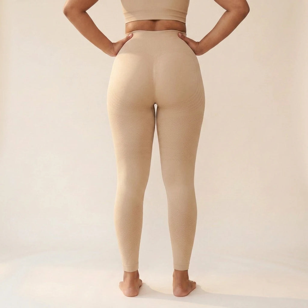 Elya beige tummy control leggings, back view with hands on hips — shape and support, seamless high waist