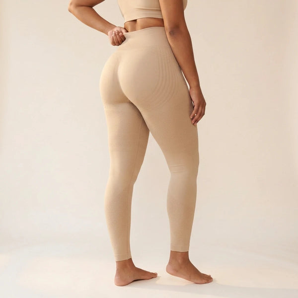 Elya beige tummy control leggings, three-quarter back view — front tummy-control panel, seamless high waist