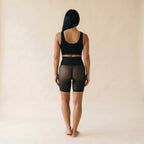 Panty anti-frottement noir vu de dos, maille voilée invisible